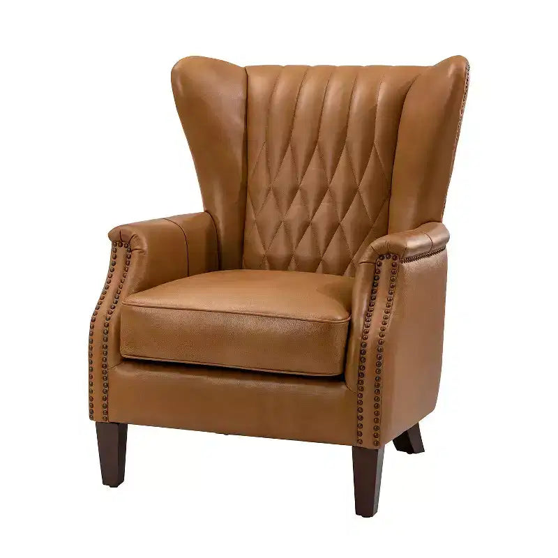 Fauteuil à oreilles en cuir véritable avec clous décoratifs et pieds fuselés en bois massif